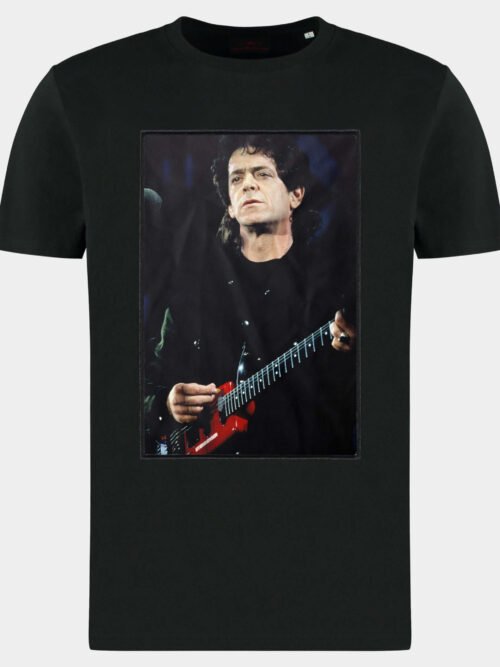 pack shot with patch showing a photograph of Lou Reed performing on stage